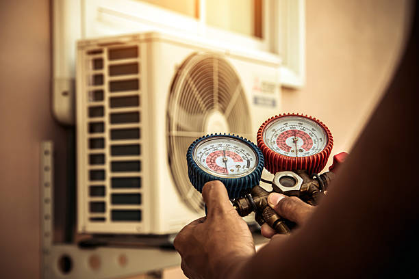 Professional Air Conditioning Service technician working in Bellmont, IL